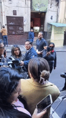 Media crews gather for interviews on La Paz streets