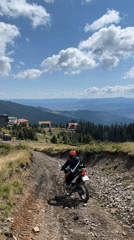 Dirt bike climbing a rocky mountain road in the Carpathians