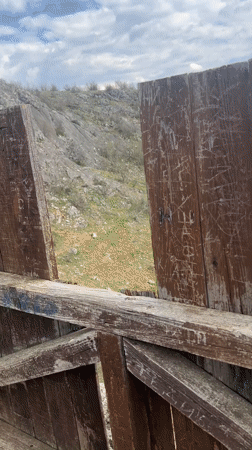 Spring visitor documents forest views from Bulgarian lookout tower