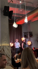 Singer performs at upscale Moscow restaurant during dinner service