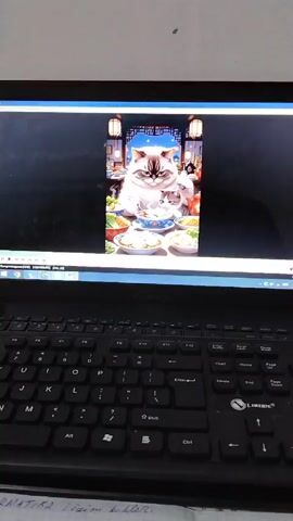 The video shows a laptop displaying an image of a large, fluffy cat sitting at a table laden with Chinese food. The cat has a disapproving expression and is seemingly about to eat with a fork. A smaller cat sits next to it, also looking at the food. The background of the image has Chinese lanterns and architecture, setting a restaurant scene. The laptop is open, showing the image on the screen with a black keyboard in the foreground. Some writing is visible on a paper underneath the keyboard. The overall scene is captured from a medium-shot angle.