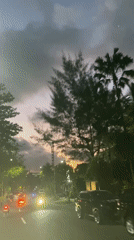 Evening traffic flows through Kuta Selatan streets at dusk