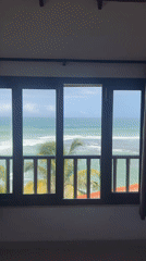 Ocean view captured from indoor window in Goviyapana, Sri Lanka