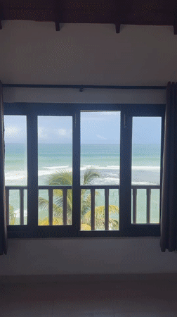 Ocean view captured from indoor window in Goviyapana, Sri Lanka