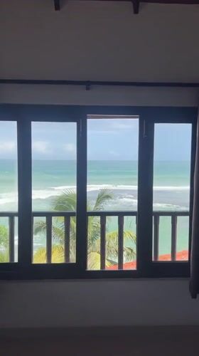 Ocean view captured from indoor window in Goviyapana, Sri Lanka