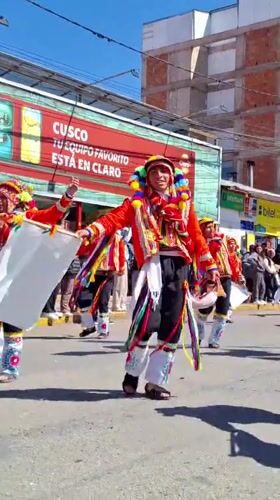 Traditional festival parade with costumed dancers in Cuzco, Peru