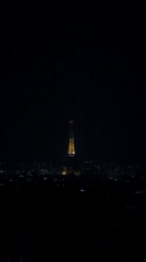 Eiffel Tower glowing gold against the Paris night sky