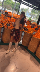 Woman shops for fruit at Thailand supermarket