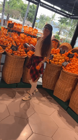 Woman shops for fruit at Thailand supermarket