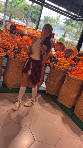 Woman shops for fruit at Thailand supermarket