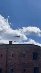 Helicopter carries red banner over Brest, Belarus