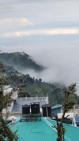 Misty hill town morning across Haini and Bhagsu