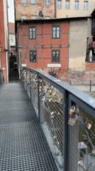 Love locks documented on Bydgoszcz bridge at dusk