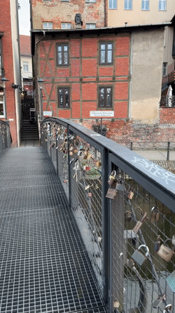 Love locks documented on Bydgoszcz bridge at dusk