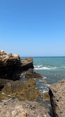Rocky Orpesa coastline on a clear summer afternoon