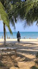 Unicycling on a Nha Trang beach under clear skies