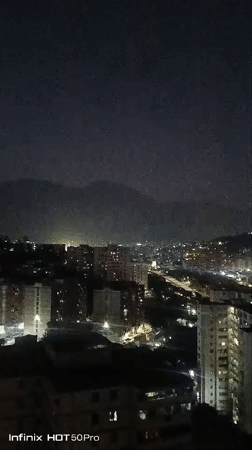 Evening scenes captured across Caracas showing cityscape and mountains