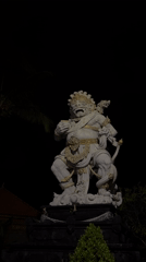 Nighttime documentation of Balinese Hindu temple and surrounding tourist streets