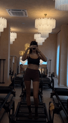 Women take mirror selfies at North Kuta fitness studio
