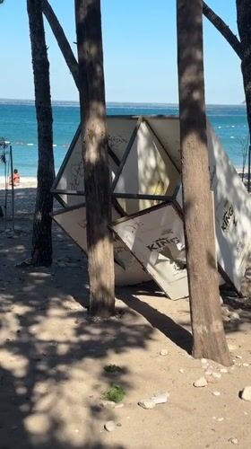 Beach day in Bar: branded stand, shoreline crowd, ice cream stop