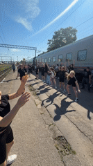 Youth group performs synchronized dance routine at Russian train station