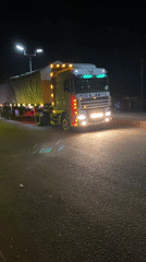 Trucks observed on nighttime street in Bukuru, Nigeria