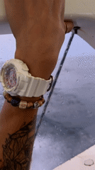 Boat operator navigates waters near Ko, Thailand during rainy conditions