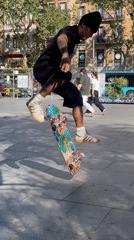Skateboarder attempts trick in Barcelona public square