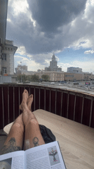 Tattooed person documents quiet morning routine in Khimki apartment