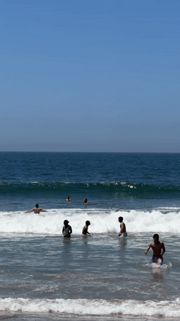 Santa Monica beachgoers enjoy sunny evening ocean activities