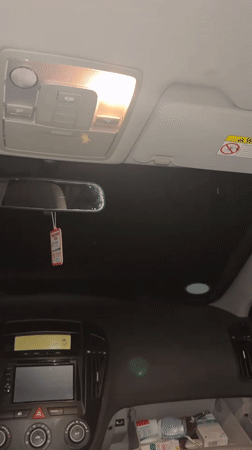 Person documents Kia car interior in Bulgarian village