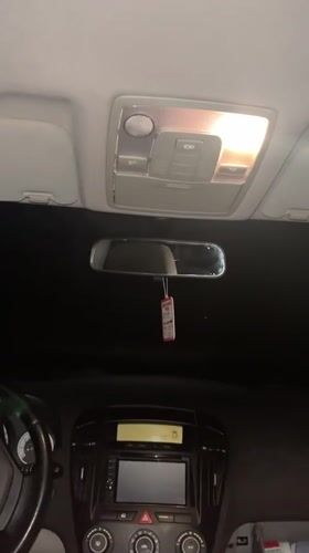 Person documents Kia car interior in Bulgarian village