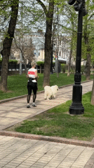 Morning jogger and peace sign pose captured in Moscow park