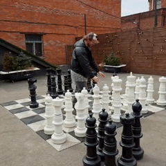 Outdoor chess game draws crowd in Saint Petersburg courtyard