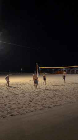 Evening beach volleyball and selfies captured in Tel Aviv