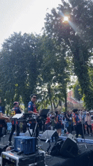 Late-night band performance and cycling group gather in Surabaya