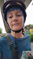 Woman films selfie video while riding scooter in Hanoi
