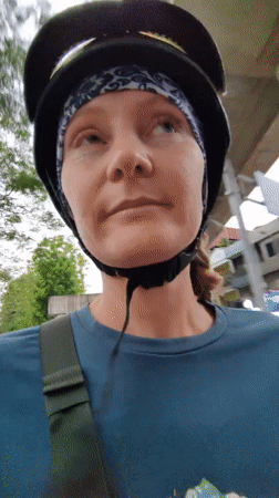 Woman films selfie video while riding scooter in Hanoi