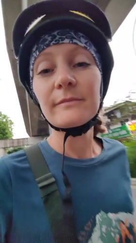 Woman films selfie video while riding scooter in Hanoi