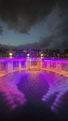Evening light show at illuminated park complex in Krasnodar