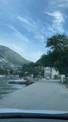 Vehicle records coastal drive through Muo, Montenegro bay area