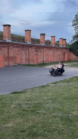Vintage motorcycle with sidecar rolling through Brest, Belarus