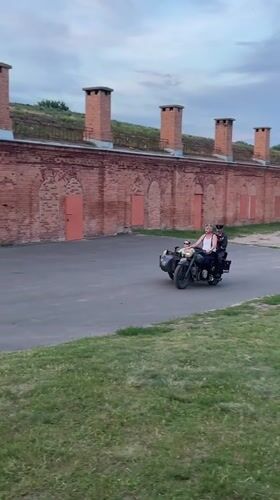 Vintage motorcycle with sidecar rolling through Brest, Belarus