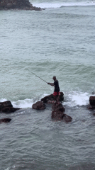 Rock fishing on Sri Lanka's southern coast under stormy skies