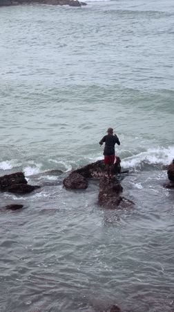 Rock fishing on Sri Lanka's southern coast under stormy skies