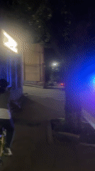 Friday evening street scenes feature dog, cyclist, police lights