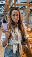 Woman makes mobile payments at bakery, airport cafe in Montenegro