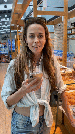 Woman makes mobile payments at bakery, airport cafe in Montenegro