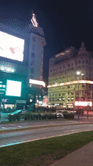 Nighttime street scenes captured across Buenos Aires including capybara costume