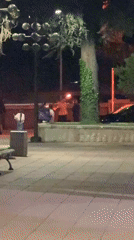 Person kneels with lit torches on Blagoevgrad walkway